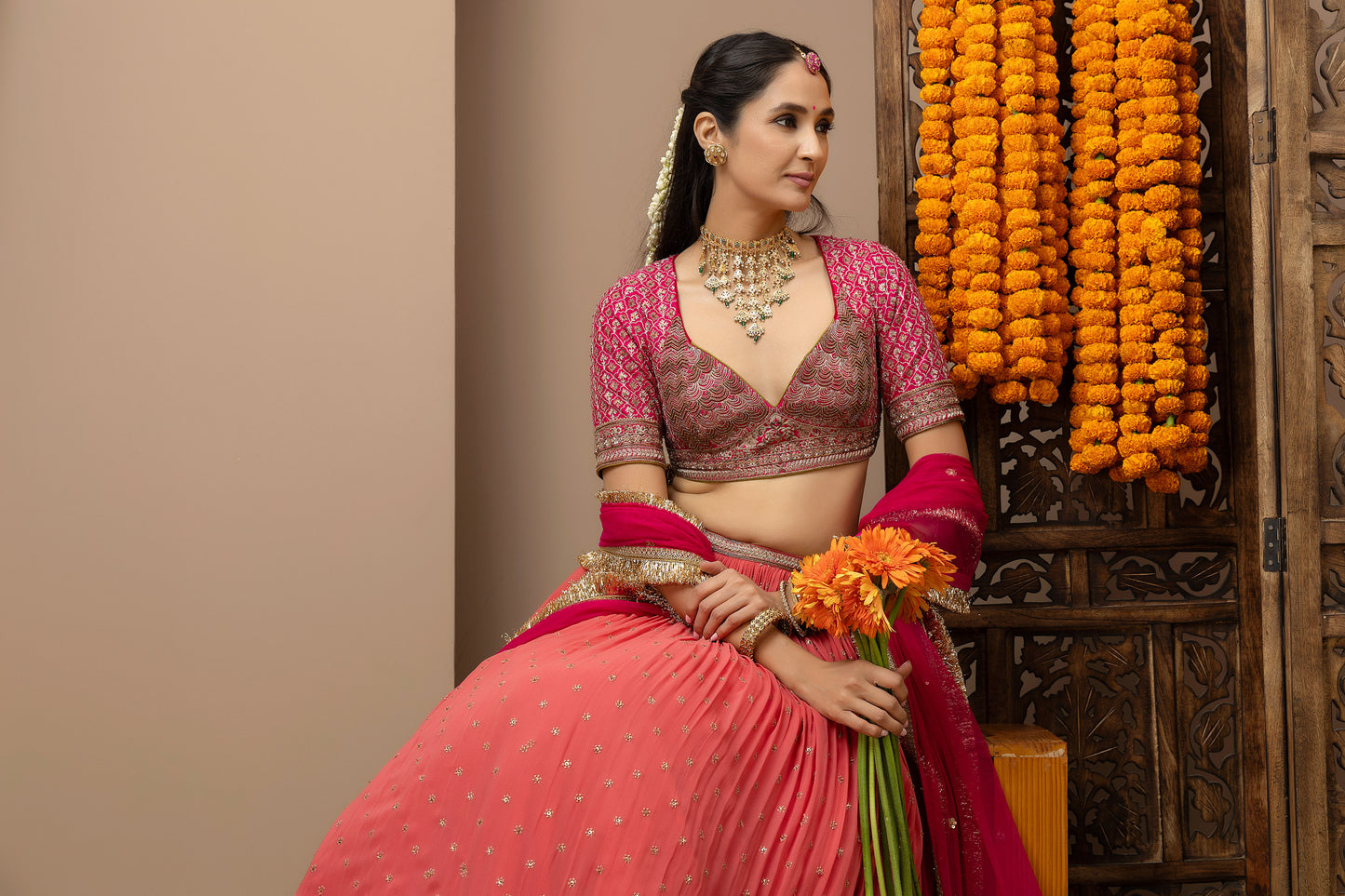 MMD/GUL/109 Gulab aangi embroidered dupion blouse with a peach georgette lehenga paired with a chinta sitara kinari dupatta.