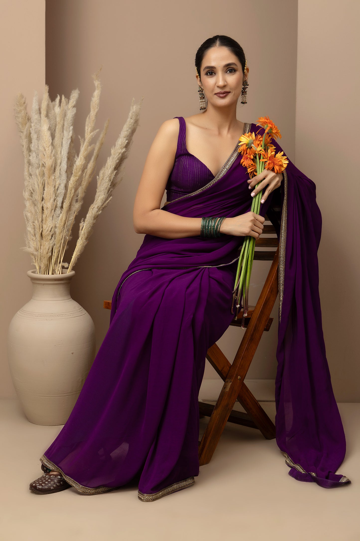 MMD/GUL/117 A soft georgette saree with a handcrafted border, paired with a tailored blouse for refined contemporary elegance.