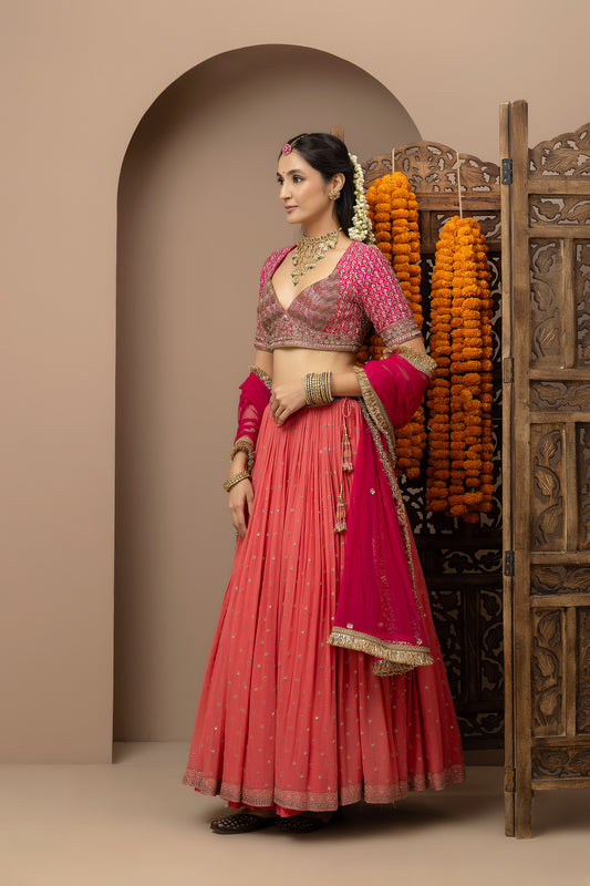 MMD/GUL/109 Gulab aangi embroidered dupion blouse with a peach georgette lehenga paired with a chinta sitara kinari dupatta.