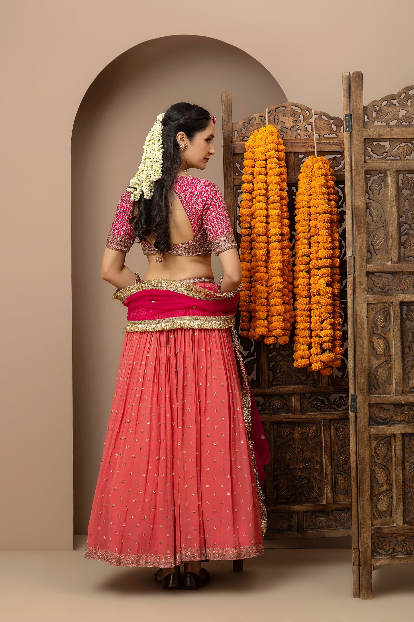 MMD/GUL/109 Gulab aangi embroidered dupion blouse with a peach georgette lehenga paired with a chinta sitara kinari dupatta.