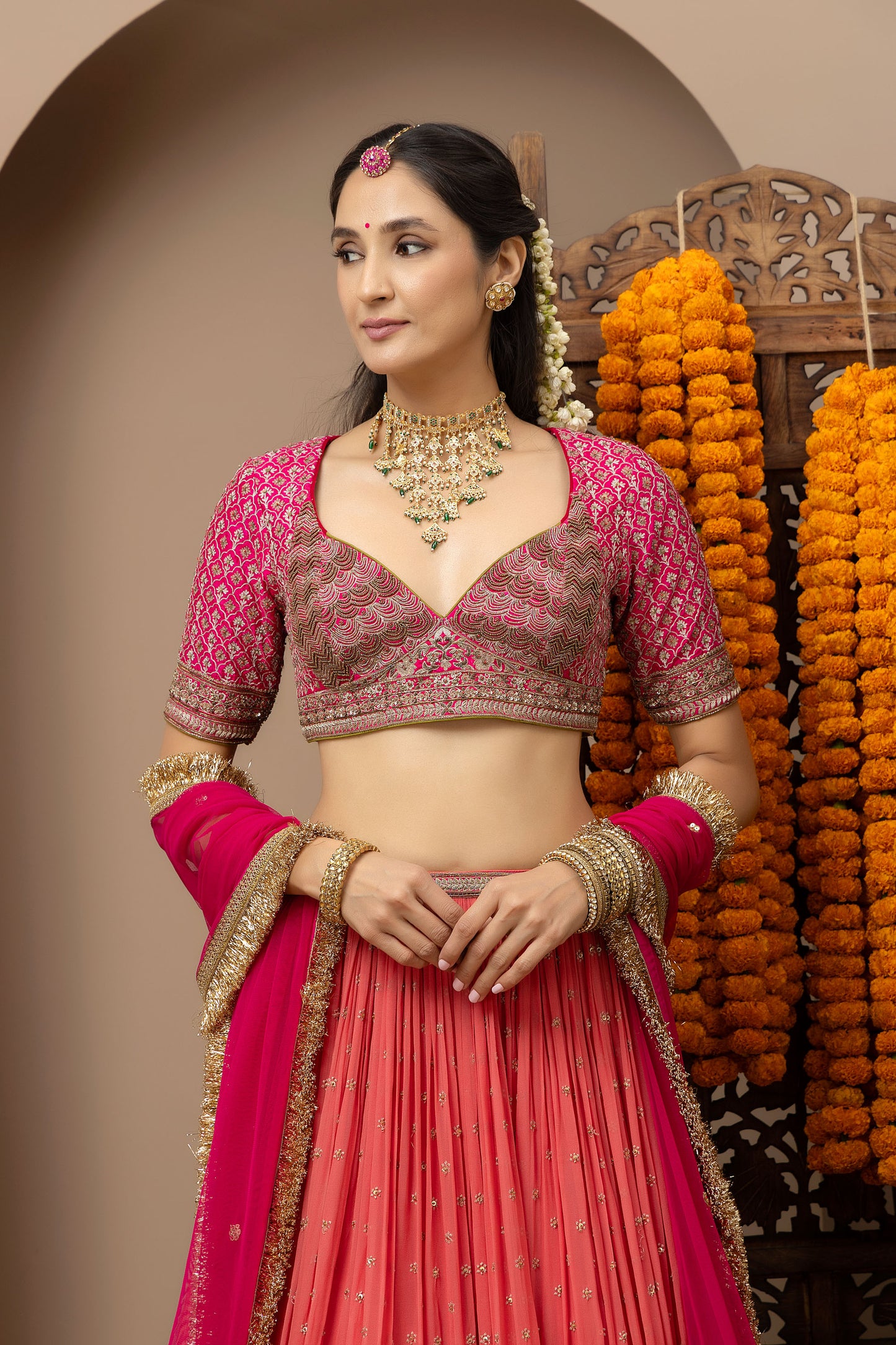 MMD/GUL/109 Gulab aangi embroidered dupion blouse with a peach georgette lehenga paired with a chinta sitara kinari dupatta.