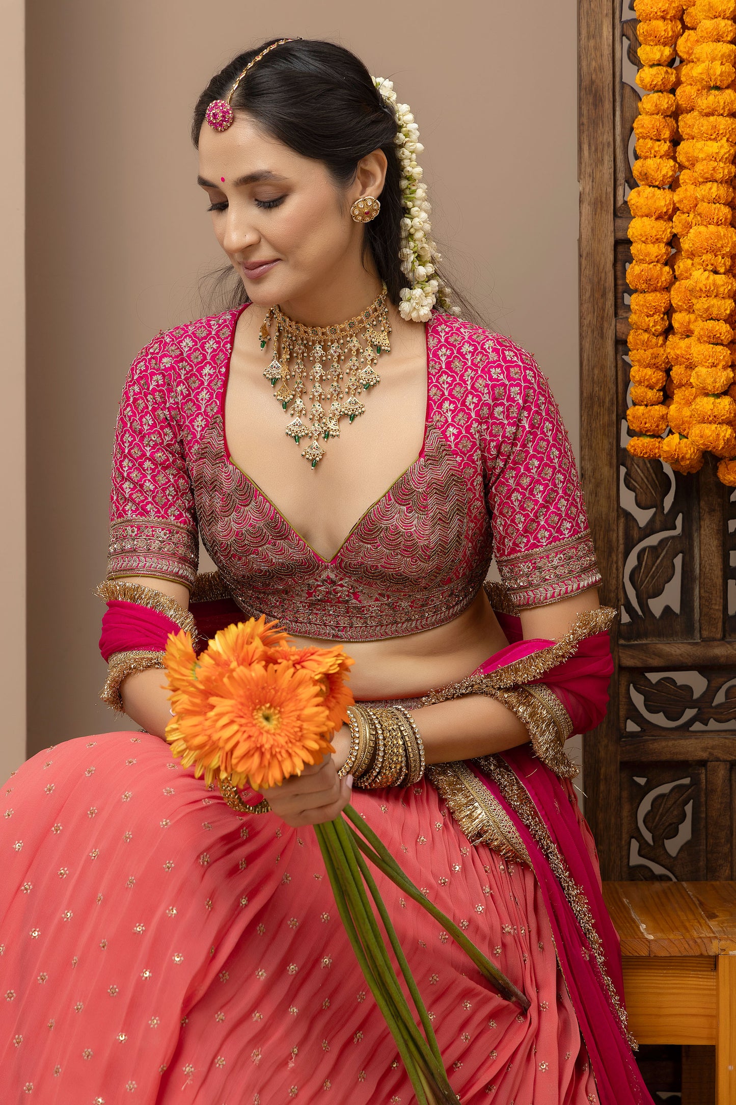 MMD/GUL/109 Gulab aangi embroidered dupion blouse with a peach georgette lehenga paired with a chinta sitara kinari dupatta.