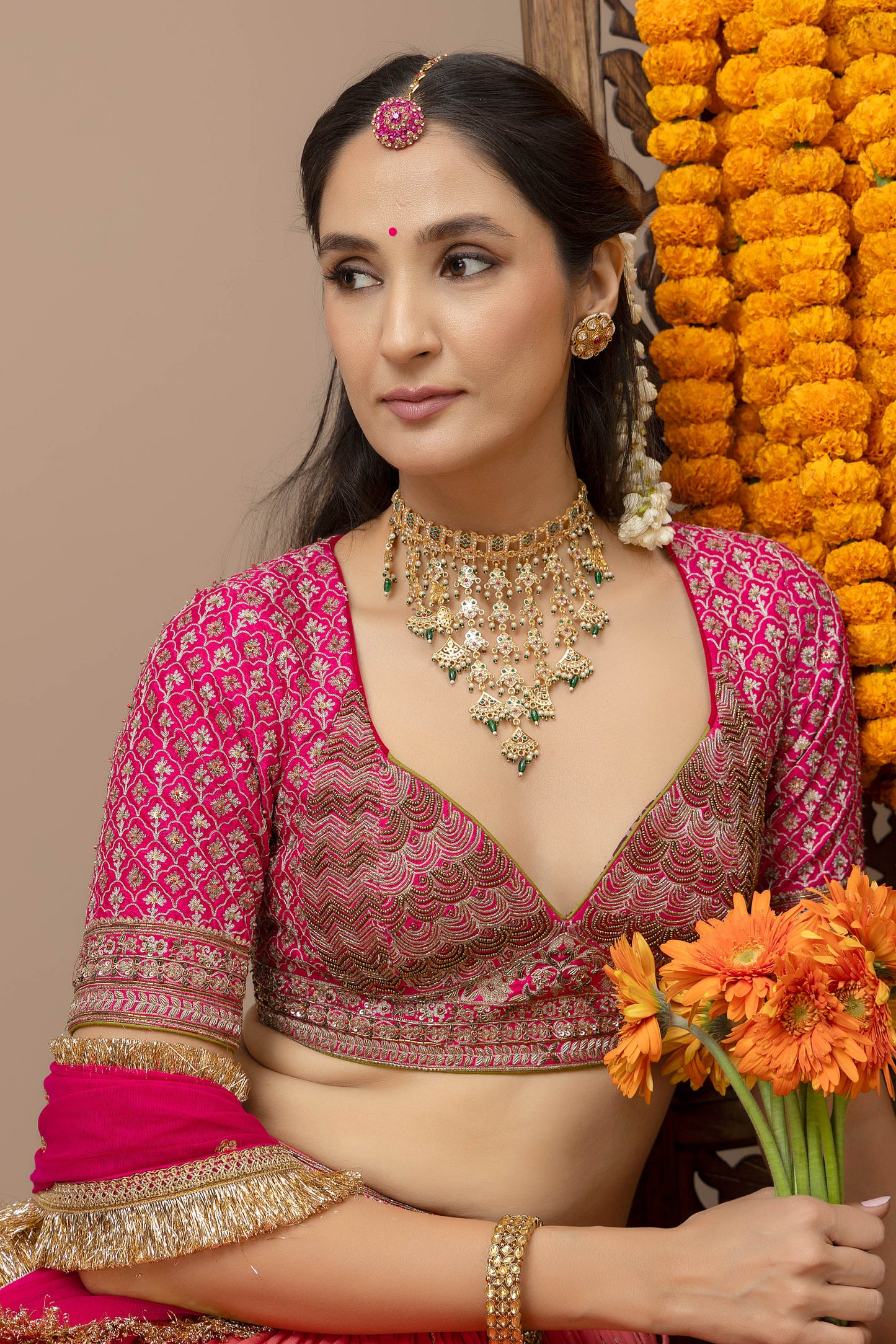 MMD/GUL/109 Gulab aangi embroidered dupion blouse with a peach georgette lehenga paired with a chinta sitara kinari dupatta.