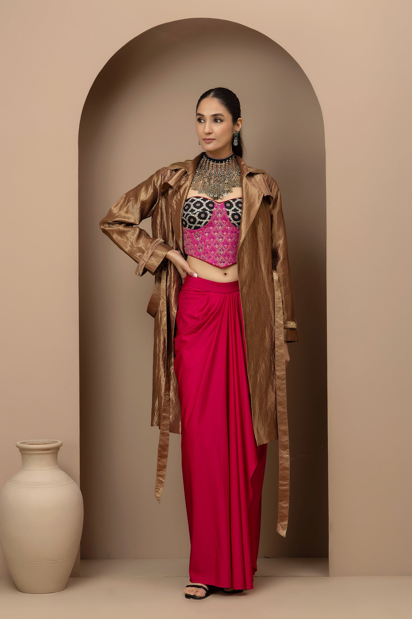 MMD/GUL/112 Aari embroidered corset blouse with lycra-stitched dhoti pants, complemented by a gold tissue jacket for a refined contemporary look.