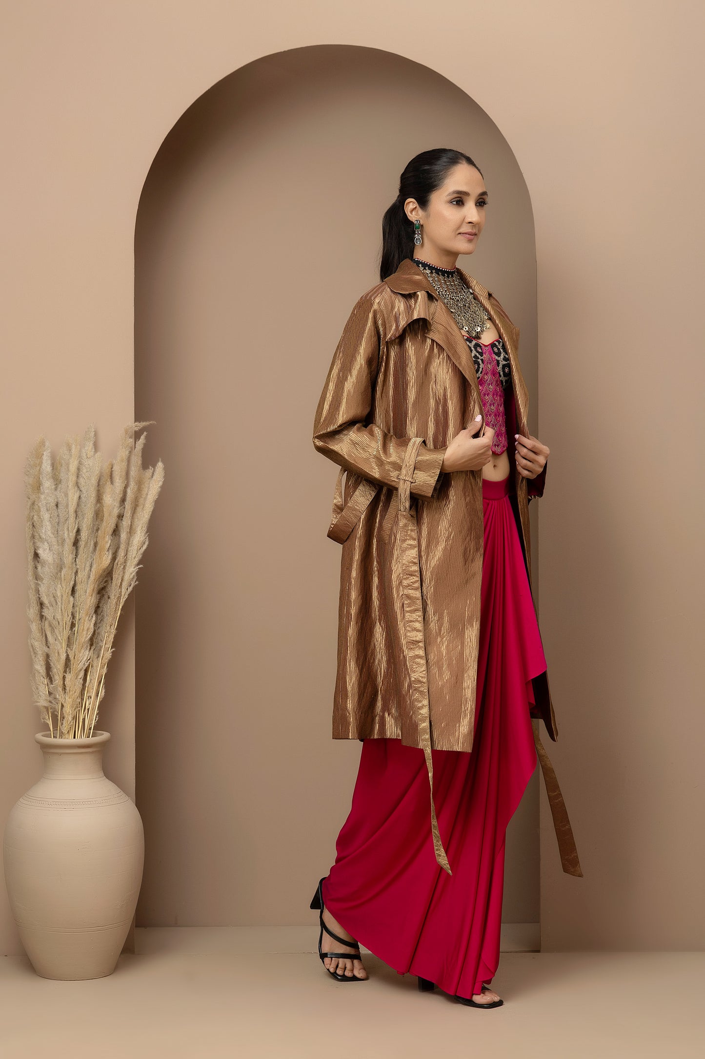 MMD/GUL/112 Aari embroidered corset blouse with lycra-stitched dhoti pants, complemented by a gold tissue jacket for a refined contemporary look.