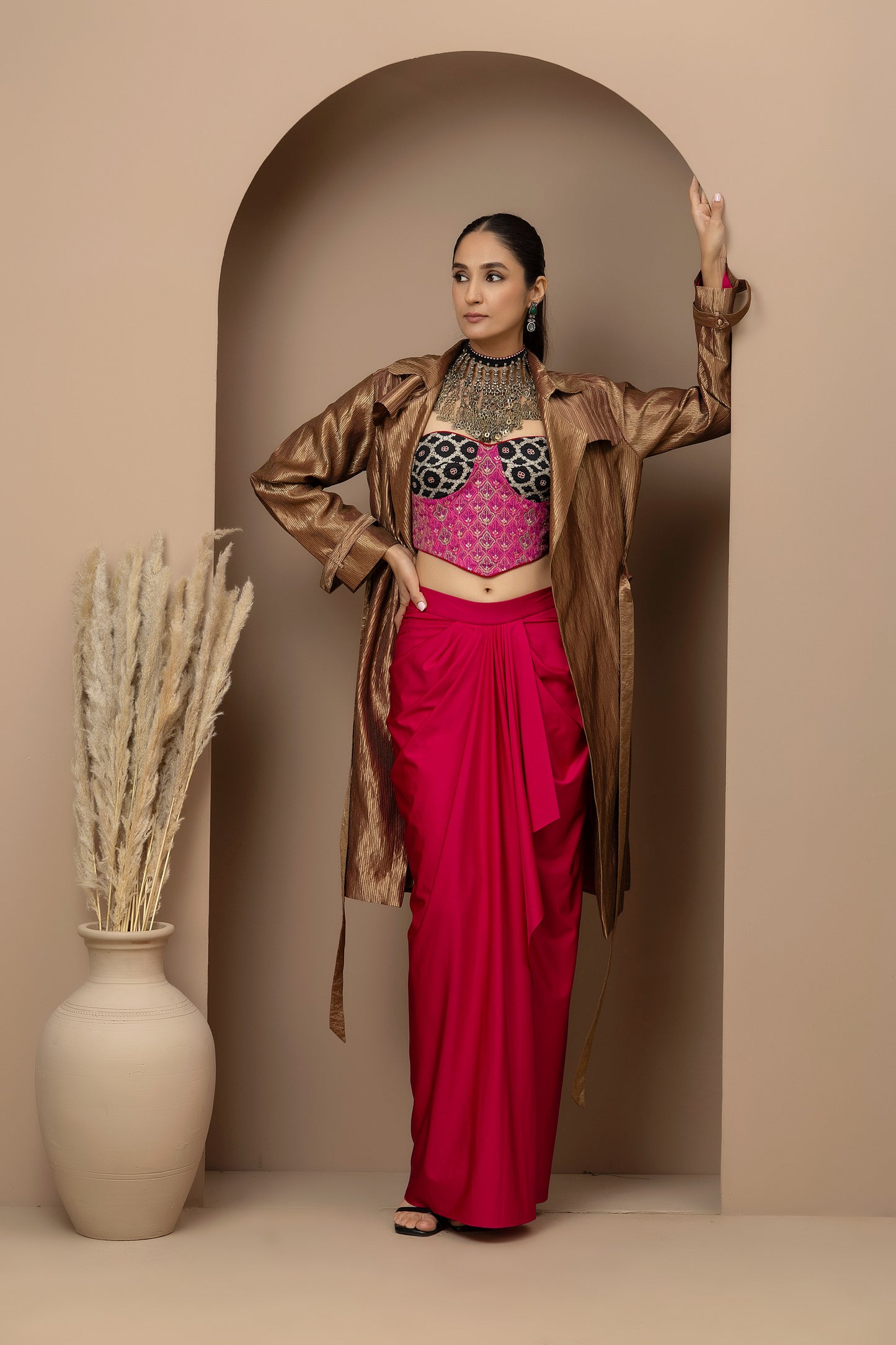MMD/GUL/112 Aari embroidered corset blouse with lycra-stitched dhoti pants, complemented by a gold tissue jacket for a refined contemporary look.