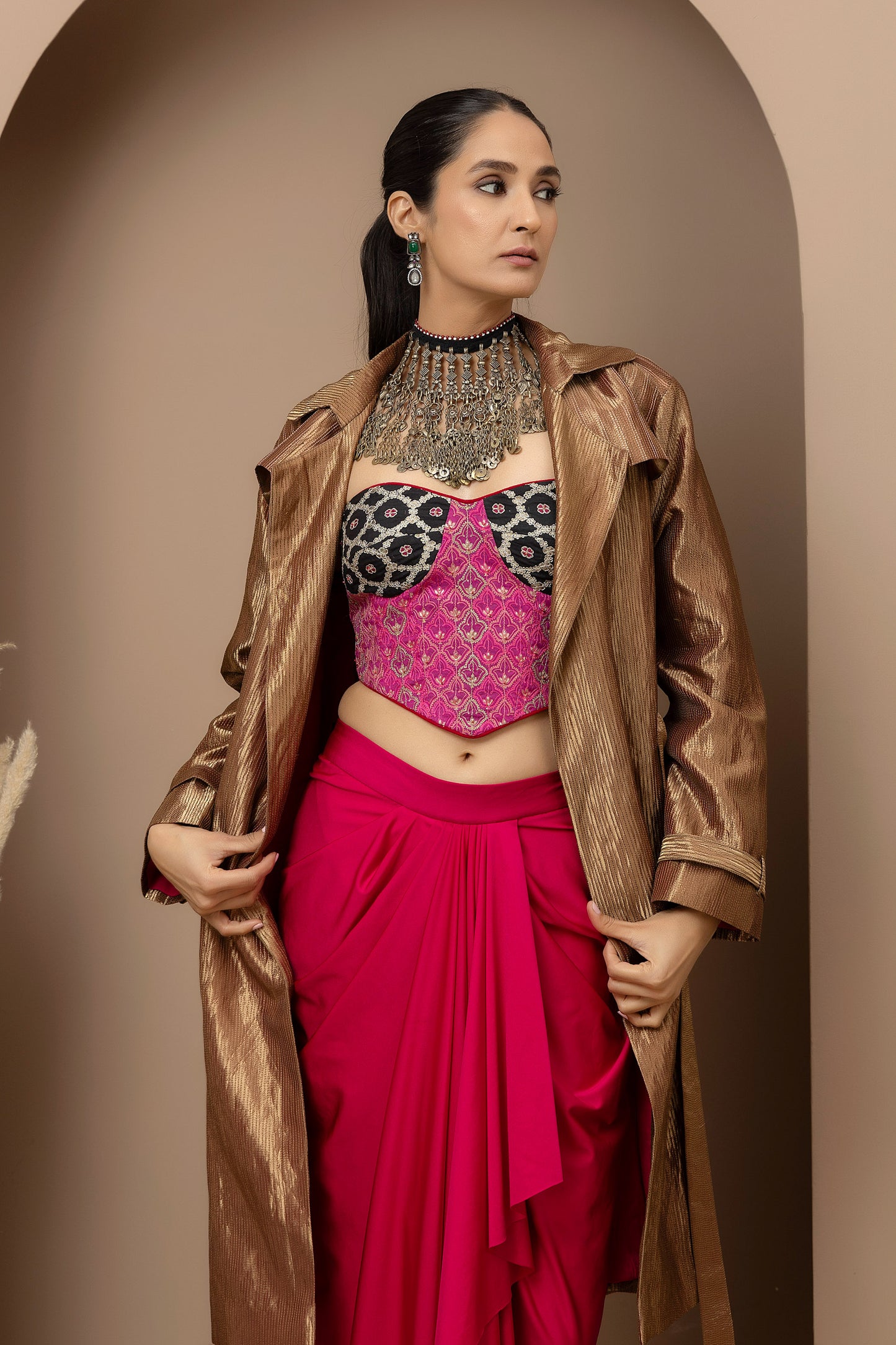 MMD/GUL/112 Aari embroidered corset blouse with lycra-stitched dhoti pants, complemented by a gold tissue jacket for a refined contemporary look.