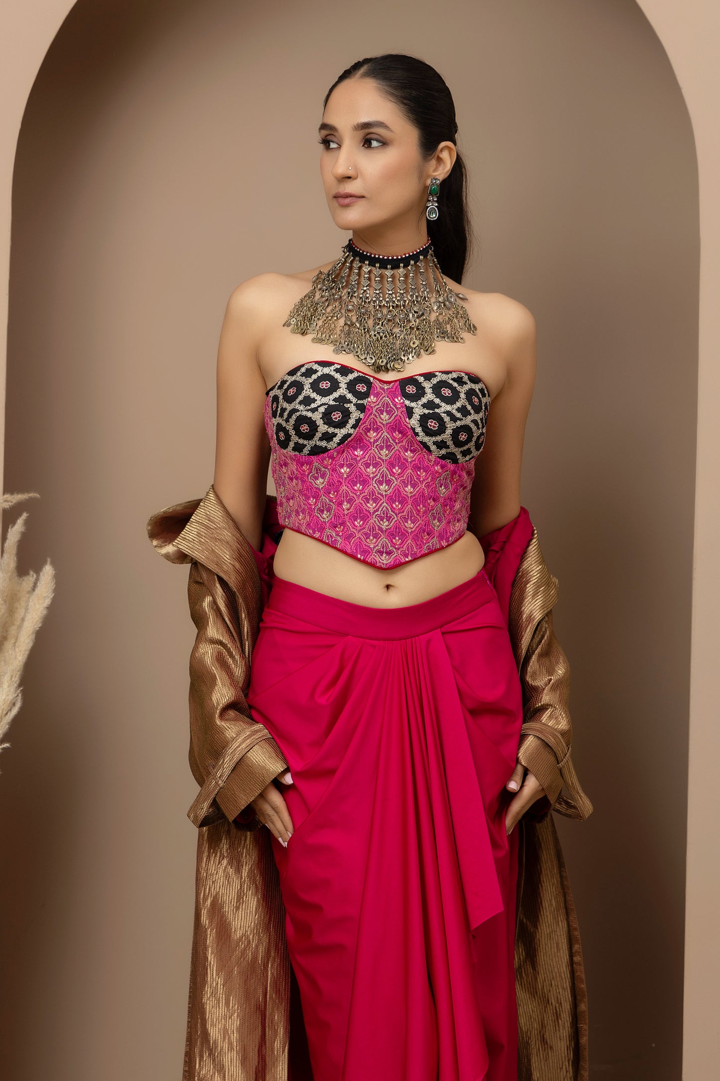 MMD/GUL/112 Aari embroidered corset blouse with lycra-stitched dhoti pants, complemented by a gold tissue jacket for a refined contemporary look.