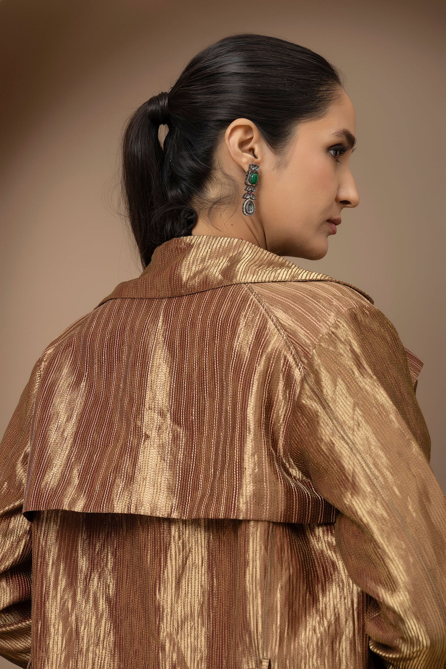 MMD/GUL/112 Aari embroidered corset blouse with lycra-stitched dhoti pants, complemented by a gold tissue jacket for a refined contemporary look.