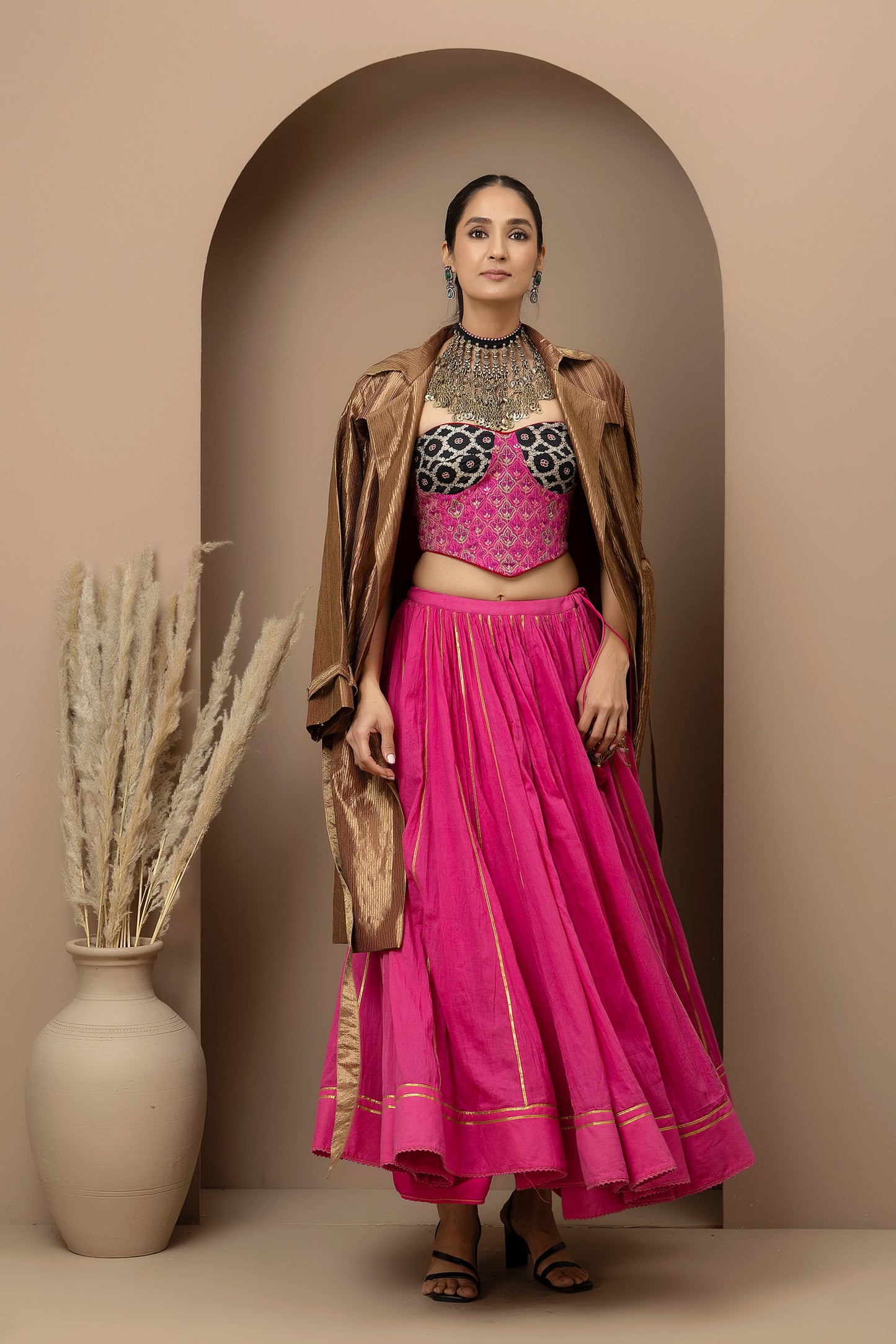 MMD/GUL/113 Aari embroidered corset blouse with mul cotton ghaghra complemented by a gold tissue jacket for a refined contemporary look.