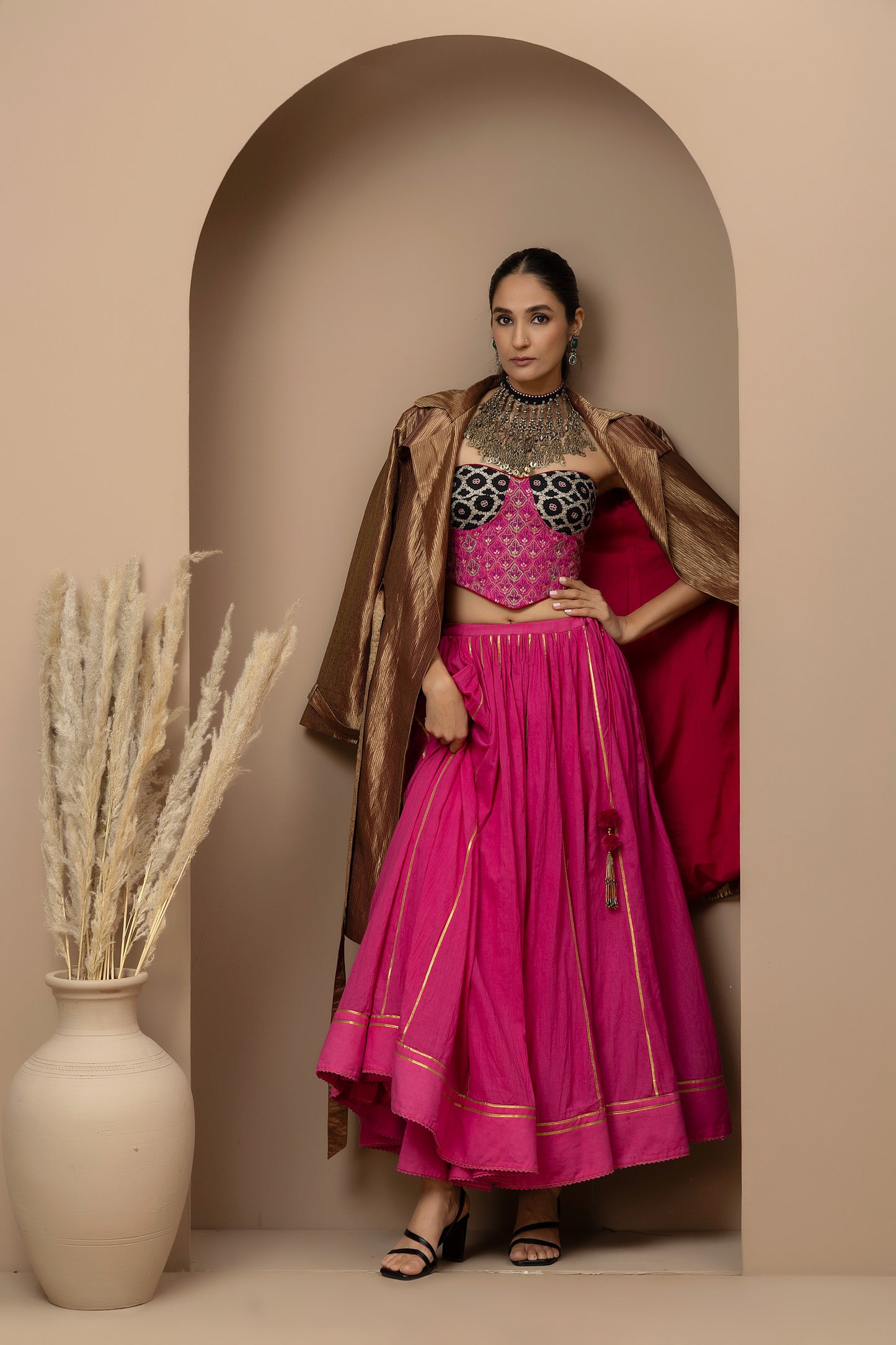 MMD/GUL/113 Aari embroidered corset blouse with mul cotton ghaghra complemented by a gold tissue jacket for a refined contemporary look.