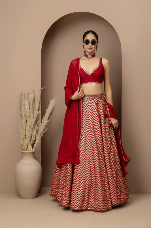 MMD/GUL/115 Silk dupion hand crafted blouse paired with chevron-patterned lehenga and a soft georgette dupatta with chinta.