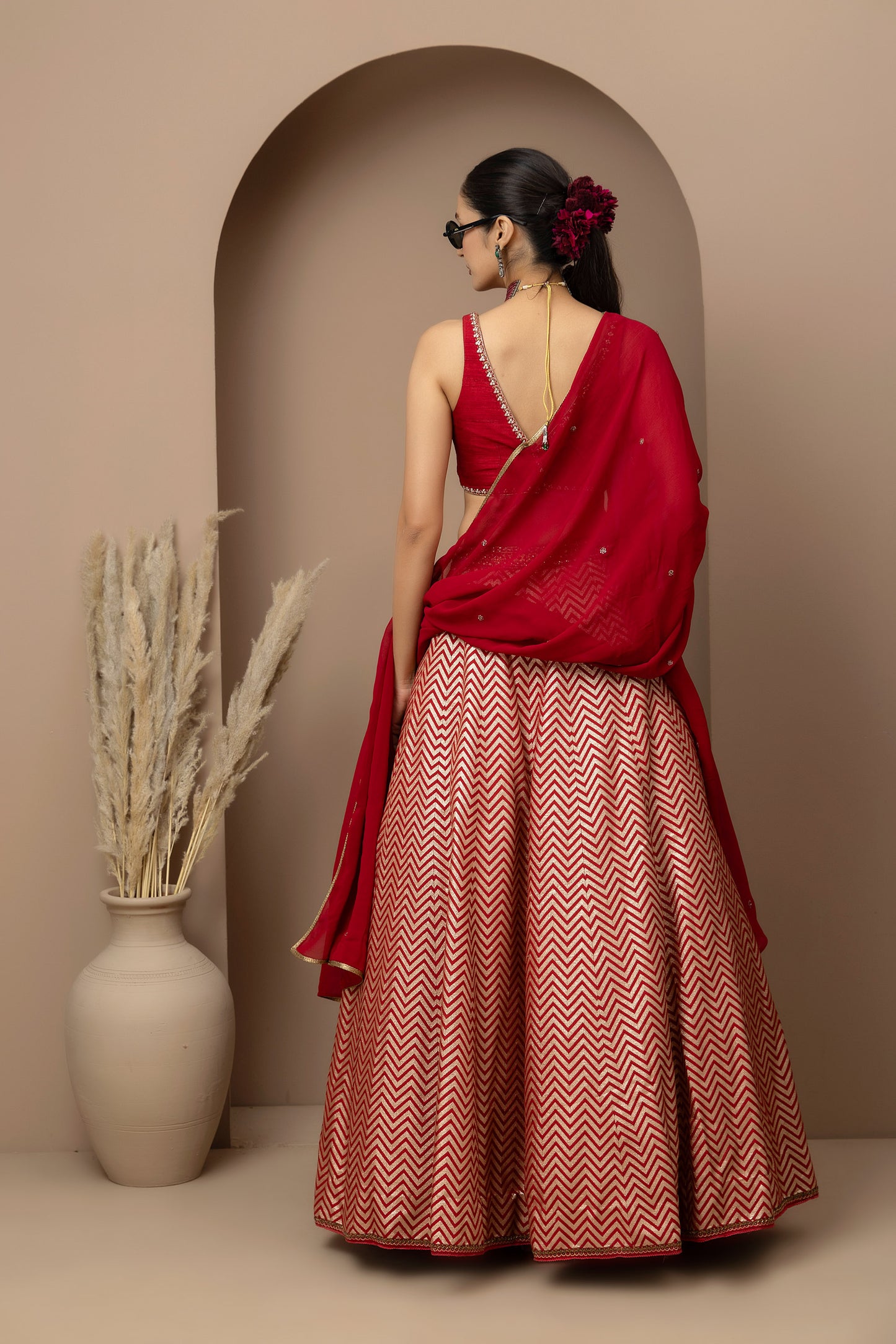 MMD/GUL/115 Silk dupion hand crafted blouse paired with chevron-patterned lehenga and a soft georgette dupatta with chinta.