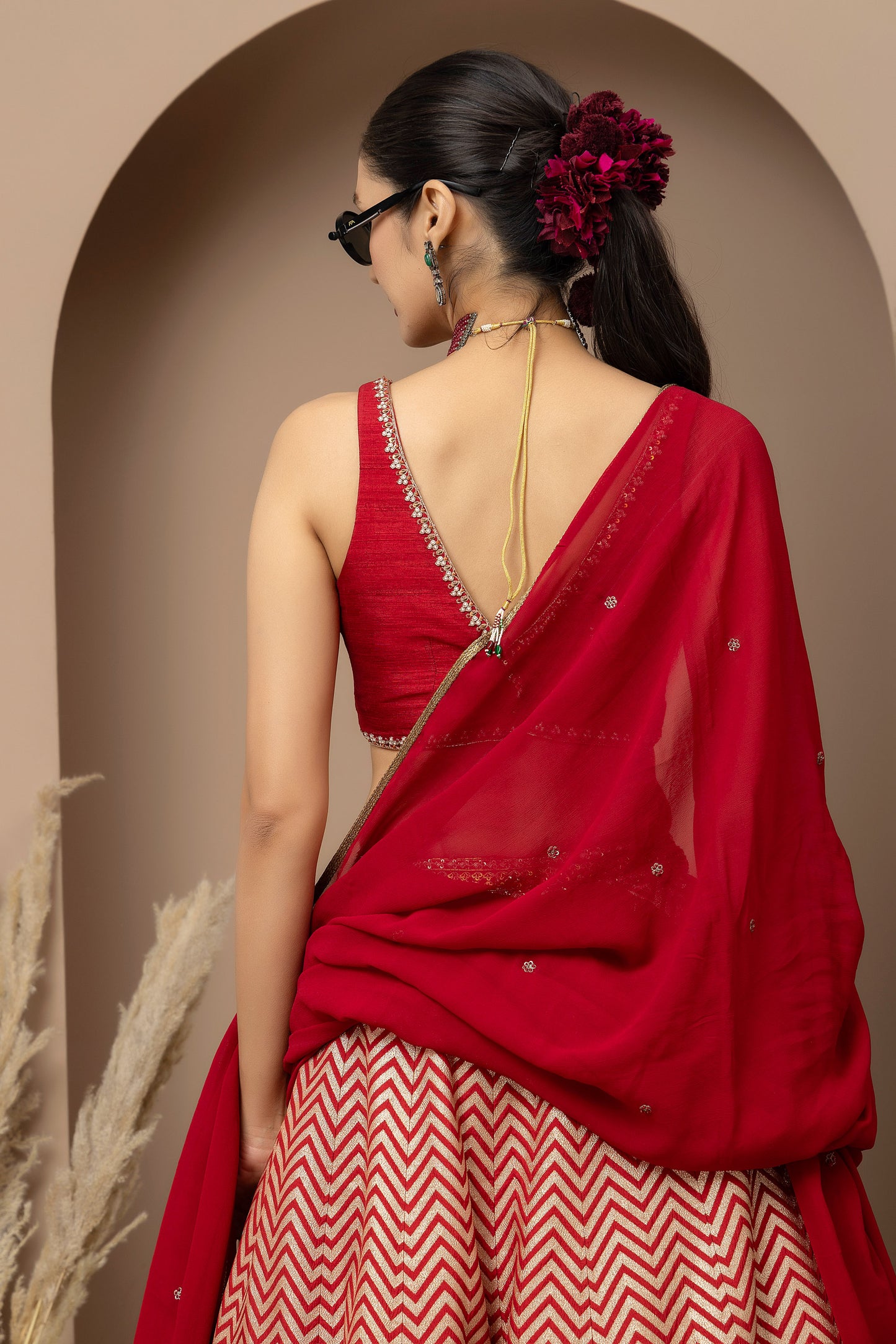 MMD/GUL/115 Silk dupion hand crafted blouse paired with chevron-patterned lehenga and a soft georgette dupatta with chinta.