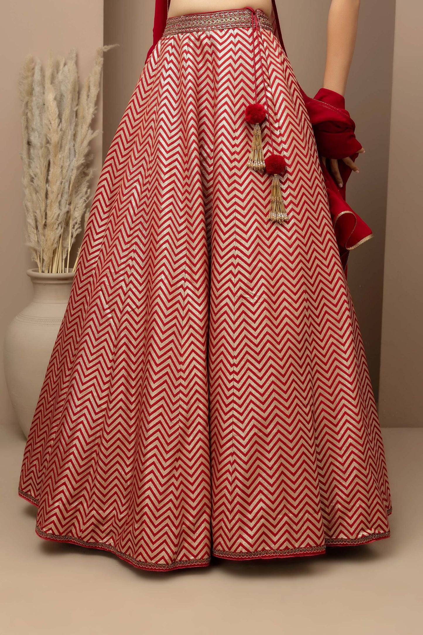 MMD/GUL/115 Silk dupion hand crafted blouse paired with chevron-patterned lehenga and a soft georgette dupatta with chinta.